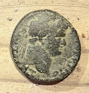 71-73 AD - Titus Judaea Capta minted in Caesarea obverse Titus, reverse female Jewish captive seated bound under trophy made of captured arms: helmet, cuirass, shields, spears